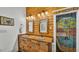 Bright main bathroom featuring a dual sink vanity with custom sinks and a decorative doorway at 520 E Stanford St, Bartow, FL 33830