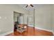 The bedroom is a beautiful space with hardwood floors and neutral walls at 520 E Stanford St, Bartow, FL 33830