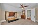 Attic bedroom with carpet flooring, built-in bed, and dresser with a charming mirror at 520 E Stanford St, Bartow, FL 33830