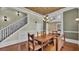 The Dining Room features staircase, chandelier, hardwood floors and seating bench at 520 E Stanford St, Bartow, FL 33830