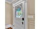 Unique door featuring an artistic glass insert, adding a touch of elegance to the home's interior at 520 E Stanford St, Bartow, FL 33830