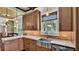 Kitchen with stainless steel farmhouse sink and beautiful wooden cabinets at 520 E Stanford St, Bartow, FL 33830