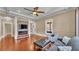 Living room featuring a fireplace with stone accents and hardwood floors at 520 E Stanford St, Bartow, FL 33830