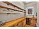 Well-organized pantry with open shelving, wooden countertops, and wine fridge at 520 E Stanford St, Bartow, FL 33830