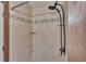 Updated tiled shower with built-in shelves and shower-head on flexible extension at 520 E Stanford St, Bartow, FL 33830