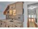 Bedroom with a mini-bar with granite countertop, backsplash and custom cabinetry at 520 E Stanford St, Bartow, FL 33830