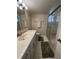 Well-maintained bathroom featuring shower, vanity with ample counter space, and neutral fixtures and finishes at 700 Mirror Nw Ter # 403, Winter Haven, FL 33881