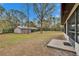 Spacious backyard with a storage shed and an attached carport; view from the sunroom at 7929 Chase Rd, Lakeland, FL 33810