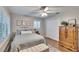 Comfortable bedroom featuring plantation shutters, hardwood floors, a closet and soft, neutral paint at 7929 Chase Rd, Lakeland, FL 33810