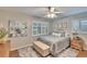 Cozy bedroom features a ceiling fan, plantation shutters, and a soft blue color palette at 7929 Chase Rd, Lakeland, FL 33810