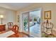 Bright dining area featuring a sliding glass door to the inviting, tiled sunroom at 7929 Chase Rd, Lakeland, FL 33810