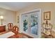 Dining space with French doors leading to a sunroom with blue tiled floors at 7929 Chase Rd, Lakeland, FL 33810