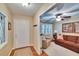 Inviting foyer with wood-look floors and a glimpse into a living room with comfortable seating at 7929 Chase Rd, Lakeland, FL 33810