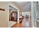 Hallway with views of the living room and dining area, featuring wood floors at 7929 Chase Rd, Lakeland, FL 33810