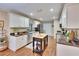 Bright kitchen with white cabinets, stainless steel appliances, and butcher block island at 7929 Chase Rd, Lakeland, FL 33810