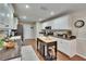 Well-lit kitchen with white cabinets, stainless steel appliances, and center island at 7929 Chase Rd, Lakeland, FL 33810