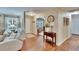 Inviting entry with wood floors and a view to the living room at 7929 Chase Rd, Lakeland, FL 33810