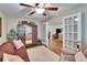 Inviting living room featuring French doors and a decorative armoire at 7929 Chase Rd, Lakeland, FL 33810