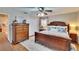 Elegant main bedroom with wood furniture and neutral color accents at 7929 Chase Rd, Lakeland, FL 33810