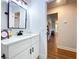 Bathroom featuring tile floors, a quartz countertop, and views to hallway and kitchen at 1040 Timbers Dr, Fort Meade, FL 33841