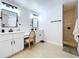 Primary bathroom featuring dual sinks, vanity, and a tile and stone shower at 1040 Timbers Dr, Fort Meade, FL 33841