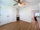 A bonus room has wood-look floors, large storage, and a view to another room at 1040 Timbers Dr, Fort Meade, FL 33841