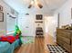 A bedroom with wood-look floors, ceiling fan, and plenty of storage at 1040 Timbers Dr, Fort Meade, FL 33841