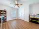 A spacious room features wood-look floors, large window, and ample storage at 1040 Timbers Dr, Fort Meade, FL 33841