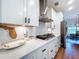 Elegant kitchen showcases white cabinets, stainless steel appliances, and quartz countertops at 1040 Timbers Dr, Fort Meade, FL 33841