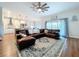 Spacious living room featuring a comfortable leather sofa, large windows, and an open layout at 1040 Timbers Dr, Fort Meade, FL 33841