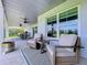 The covered patio features comfortable seating and a scenic view, perfect for relaxation and enjoying the outdoors at 1040 Timbers Dr, Fort Meade, FL 33841