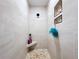 Modern shower featuring neutral tile, a corner seat, and built-in shelving at 1040 Timbers Dr, Fort Meade, FL 33841