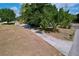 Aerial view of a house with a long driveway and some mature trees at 105 Old Connersville Rd, Bartow, FL 33830