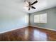 An empty bedroom with wood floors and light-blue painted walls at 105 Old Connersville Rd, Bartow, FL 33830