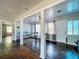 Inviting dining area with hardwood floors, neutral paint, and sunlit windows enhancing the bright space at 105 Old Connersville Rd, Bartow, FL 33830