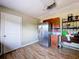 Kitchen with stainless steel refrigerator, wood-look flooring, wooden cabinets and plenty of counter space at 105 Old Connersville Rd, Bartow, FL 33830