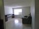 Comfortable living space with tile flooring, providing ample room for relaxation and entertainment at 112 Bishop St, Auburndale, FL 33823