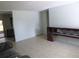 Bright and airy living room with tile flooring and a classic wood console at 112 Bishop St, Auburndale, FL 33823