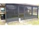 Enclosed patio offers a versatile outdoor living space perfect for relaxation at 112 Bishop St, Auburndale, FL 33823