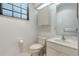 Cozy half-bathroom featuring a single sink vanity and ample cabinet space at 1131 Country Oaks Blvd, Lake Wales, FL 33898