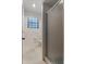 Bathroom featuring a toilet, shower with glass doors, and a window for natural light at 1131 Country Oaks Blvd, Lake Wales, FL 33898