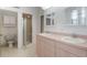 Spacious bathroom with double sinks, walk in shower, and toilet at 1131 Country Oaks Blvd, Lake Wales, FL 33898