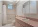Bright bathroom with a shower, toilet, and a single sink vanity with ample storage at 1131 Country Oaks Blvd, Lake Wales, FL 33898
