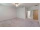 Spacious bedroom with plush carpeting and a ceiling fan to keep the room comfortable at 1131 Country Oaks Blvd, Lake Wales, FL 33898