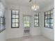 Sun-filled dining area featuring tile floors and backyard access at 1131 Country Oaks Blvd, Lake Wales, FL 33898