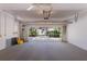 Spacious garage with an open door revealing a well-lit interior and ample storage space at 1131 Country Oaks Blvd, Lake Wales, FL 33898