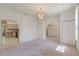 Spacious living area with carpet, archways, and view of kitchen at 1131 Country Oaks Blvd, Lake Wales, FL 33898