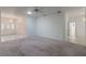 Spacious living room with plush carpeting, neutral walls, and views of the front entry with tile flooring at 1131 Country Oaks Blvd, Lake Wales, FL 33898