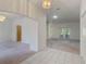 Open concept living area with neutral carpet and natural light at 1131 Country Oaks Blvd, Lake Wales, FL 33898