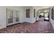 Covered patio area with brick floors, offering a relaxing outdoor space at 1131 Country Oaks Blvd, Lake Wales, FL 33898